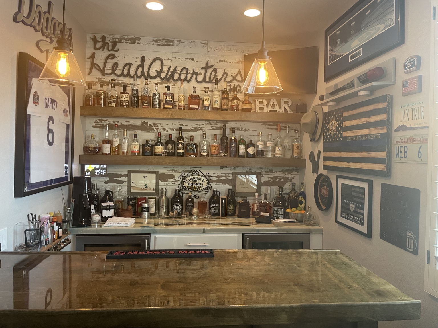 The Headquarters sign, bottle collection and sports memorabilia